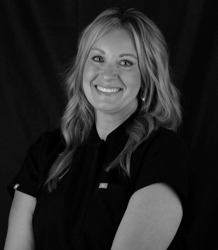 Nicole,EFDA Black and white profile image of Nicole, an EFDA at Urbana & Darby Dental Smiles.