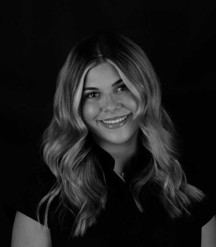 Eva, Dental Assistant Black and white profile image of Eva, a Dental Assistant at Urbana & Darby Dental Smiles.
